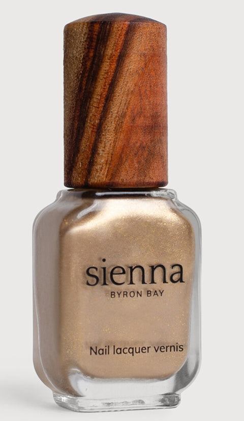 Sienna Divine champagne shimmer nail polish bottle with timber cap
