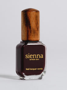 Sienna Florence deep burgundy nail polish bottle with timber cap