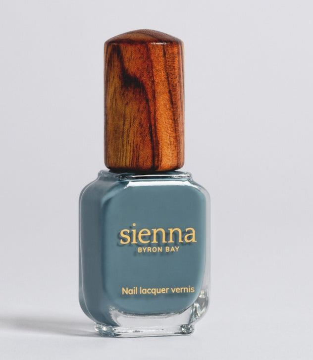 Sienna Juniper blue-grey nail polish bottle with timber cap