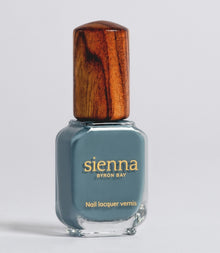 Sienna Juniper blue-grey nail polish bottle with timber cap