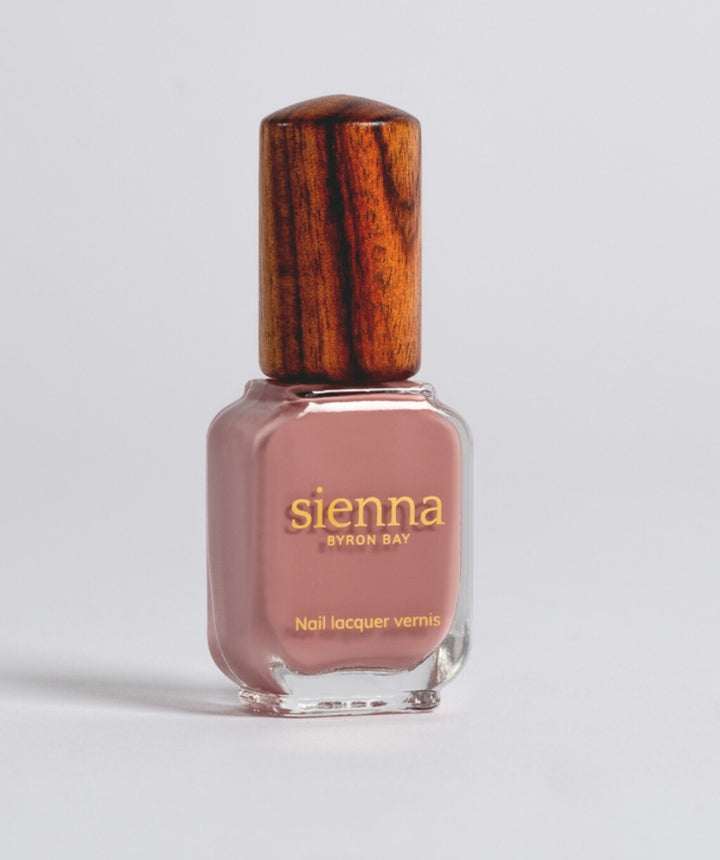 Sienna Stone mauve-pink nail polish bottle with timber cap